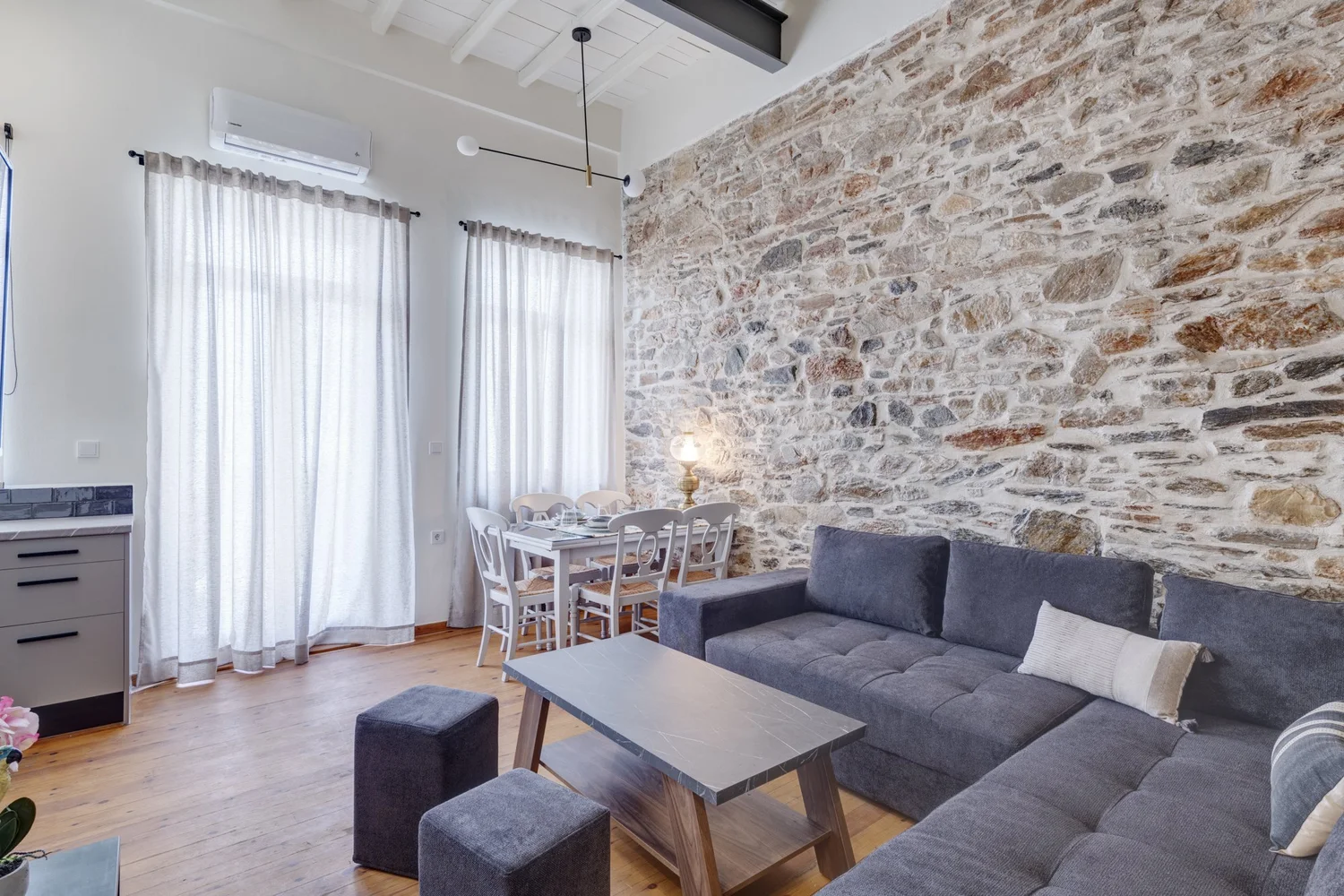 Open-plan living and dining space with high ceiling