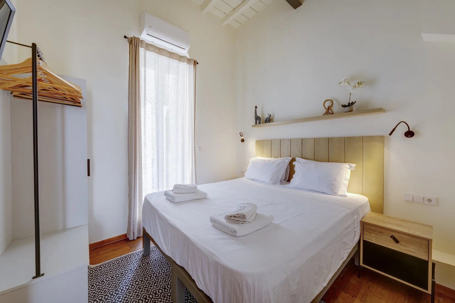 Bedroom two with its open wardrobe